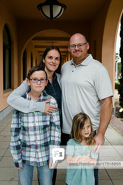 Family of Four Posing for Camera in Hallway in San Diego