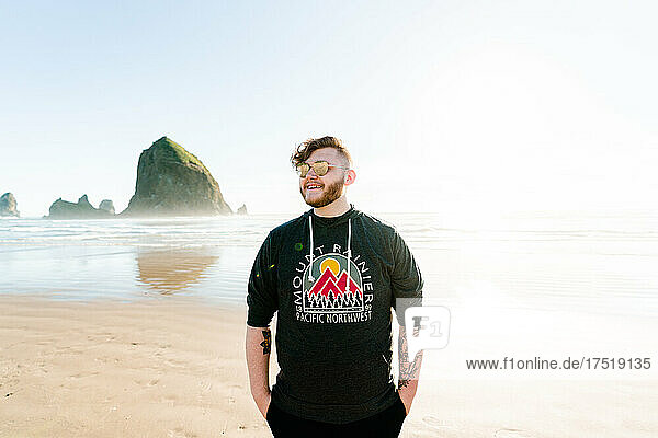 Closeup portrait of a young man at Cannon Beach in Oregon