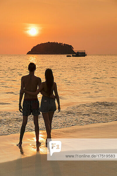 Couple at sunset  Kata Beach  Phuket  Andaman Sea  Indiian Ocean  Thailand  Southeast Asia  Asia