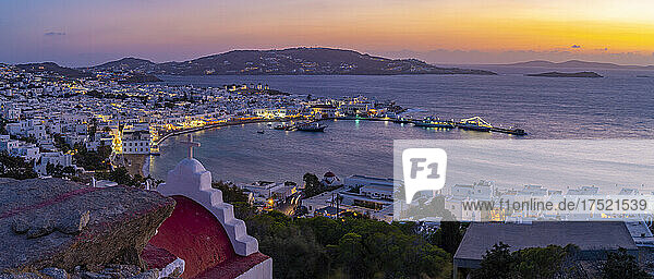 View of chapel and town from elevated view point at dusk  Mykonos Town  Mykonos  Cyclades Islands  Greek Islands  Aegean Sea  Greece  Europe