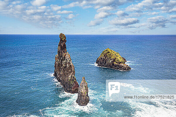 Aerial view of rock formation Ilheus da Rib and Ribeira da Janela in the rough ocean  Porto Moniz  Madeira island  Portugal  Atlantic  Europe