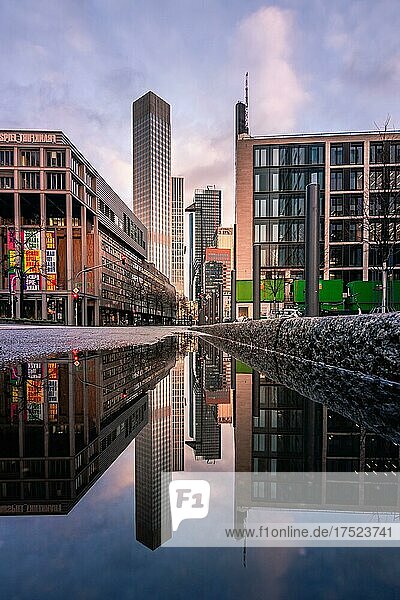Skyscraper canyon in Frankfurt am Main with view into Neue Mainzer Straße  reflection with the skyscrapers Commerzbank Tower  Eurotower  K26  Omniturm  TaunusTurm  Hesse  Germany  Europe
