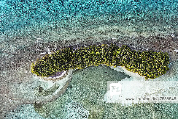 Desert island amidst sea in Lhaviyani Atoll  Maldives