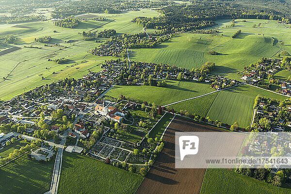 Germany  Bavaria  Berg  Aerial view of countryside village and surrounding fields and meadows in spring