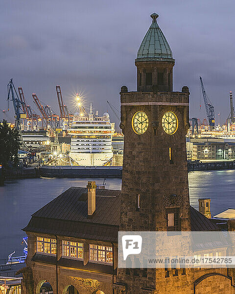 Germany  Hamburg  Saint Pauli Piers clock tower with docked cruise ship in background