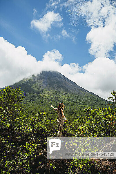 Woman on vacation admiring Arenal Volcano  Arenal Volcano National Park  La Fortuna  Alajuela Province  Costa Rica