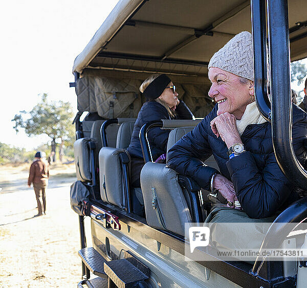 senior woman in safari vehicle  Okavango Delta  Botswana