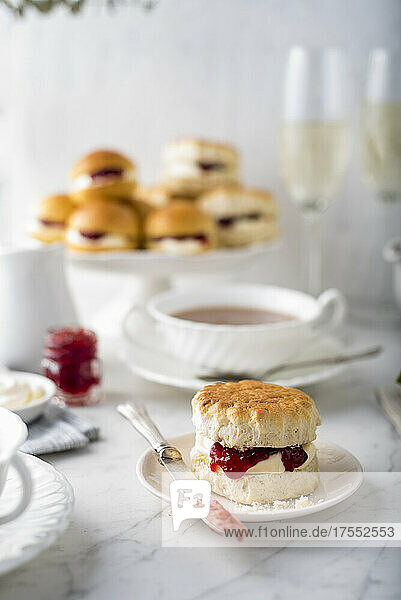 Afternoon tea with scone with cream and jam