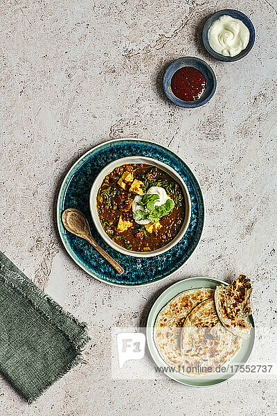 Lentil dahl with paneer  spinach and paratha