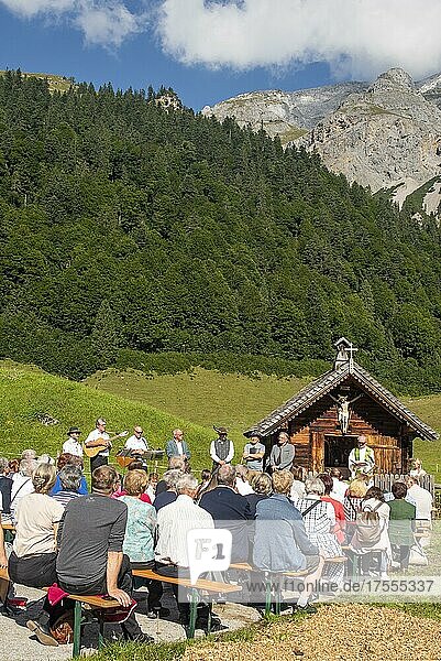 Mass celebration on Almkirtag in front of the wooden chapel in Almdorf Eng  Hinterriss  Tyrol  Austria  Europe