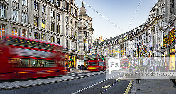 View of red buses and shops on Regent Street at Christmas  London  England  United Kingdom  Europe
