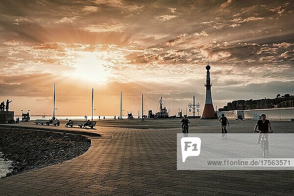 Willy-Brandt-Platz with lighthouse Unterfeuer at sunset  back light  New Harbour  Havenwelten  Bremerhaven  Bremen  Germany  Europe