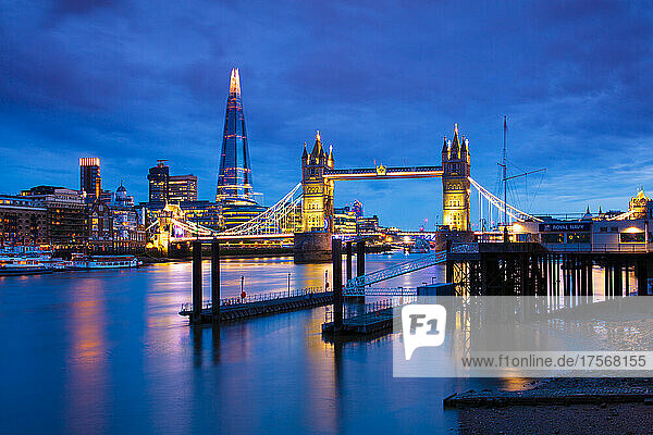 Tower Bridge and The Shard at sunset with a low tide on the River Thames  London  England  United Kingdom  Europe