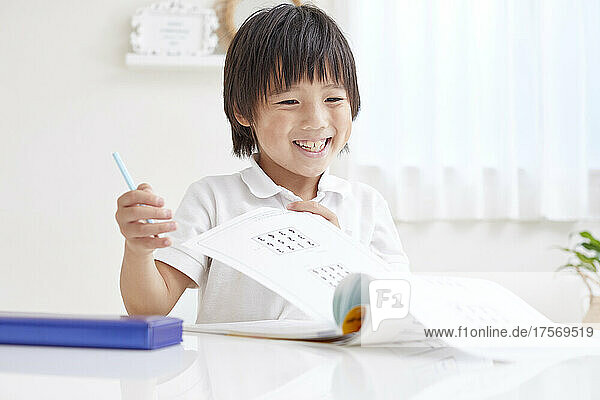 Japanese Elementary School Boy Doing His Homework
