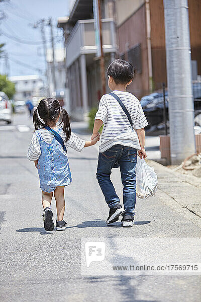 Japanese Brother And Sister Going On A Shopping Trip