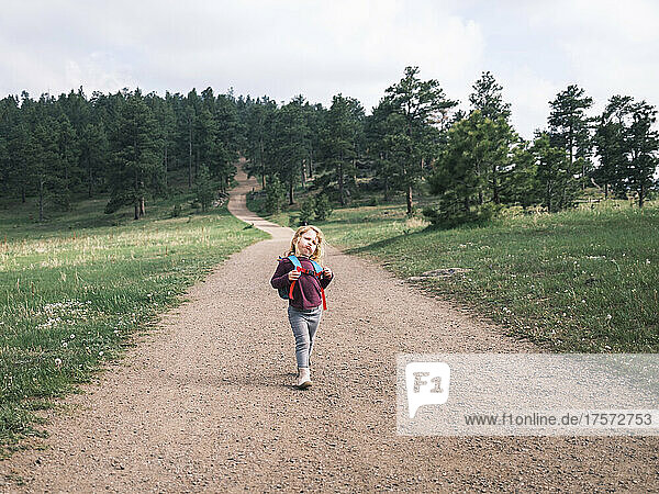 Girl hiking on a trail in Mount Falcon Park