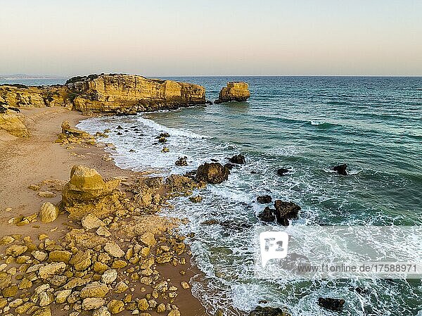 Aerial view of cliffs on Sao Rafael beach by the Atlantic Ocean at sunset  Algarve  Portugal  Europe