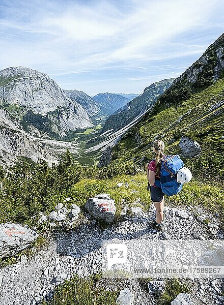 Hiker looking over mountain valley  hiking trail to Lamsenspitze  Karwendel Mountains  Tyrol  Austria  Europe
