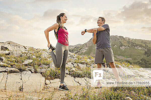 United States  Utah  Alpine  Hiking couple stretching in mountains