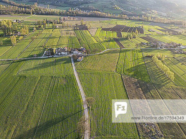 Italy  Umbria  Gubbio  Drone view of green countryside fields in spring