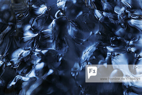 Full frame of clear blue melting ice