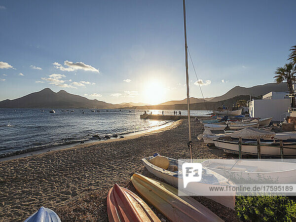 Spain  Province of Almeria  Isleta del Moro  Boats lying on beach of fishing village in Cabo de Gata at sunset