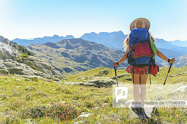 Woman with backpack hiking at Caucasus Mountains  Sochi  Russia