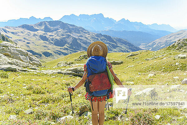 Woman hiking at Caucasus Mountains on sunny day  Sochi  Russia