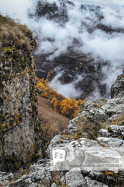 Mountainous landscape of North Caucasus on foggy autumn day