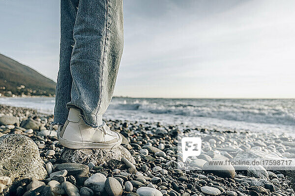 Teenage girl standing on stone at beach  Gagra  Abkhazia