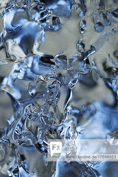 Full frame of clear melting ice