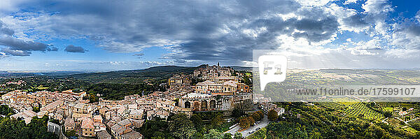 Italy  Province of Siena  Montepulciano  Helicopter panorama of medieval hill town in Val dOrcia at cloudy sunset