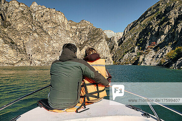 Couple traveling in boat at Chirkey reservoir  Sulak canyon  Dagestan  Russia