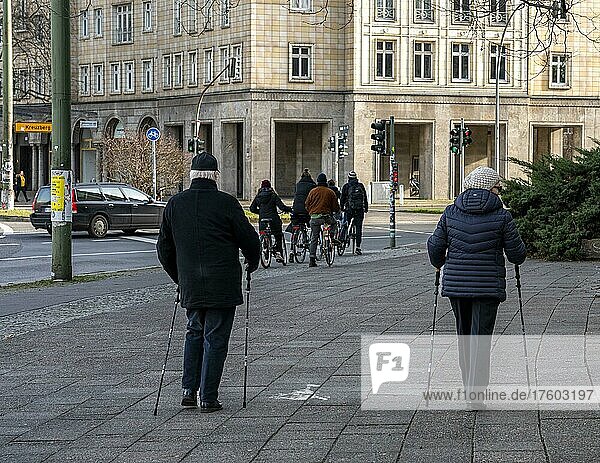 Senior couple Nordic walking in the capital  Berlin  Germany  Europe