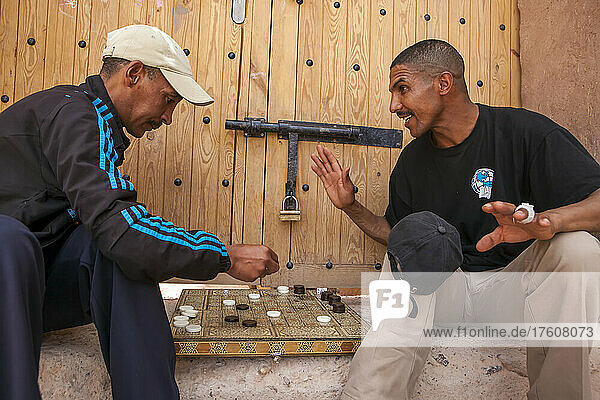 Ait Benhaddou  Morocco is a small village in the High Atlas Mountains where such films as Lawrence of Arabia and Gladiator were filmed. Two village men play checkers on a doorstep; Ait Benhaddou  Morocco