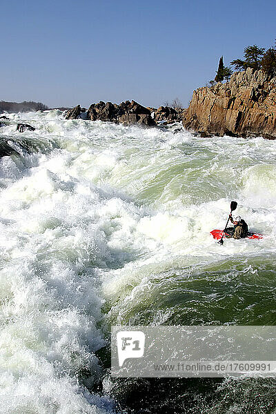 A whitewater kayaker on the verge of a big drop.; Great Falls  Potomac River  Maryland.