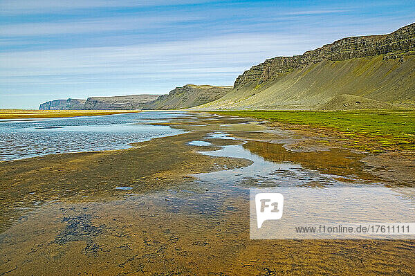 View of the sea lagoon behind behind Raudasandur Beach  near Latrabjarg; West Fjords  Iceland