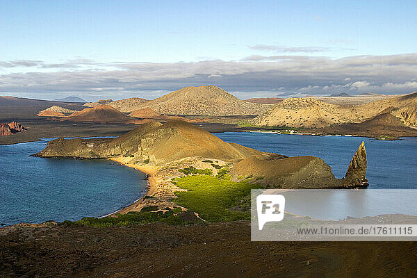Morning light shines on the volcanic landscape of Bartolome Island.
