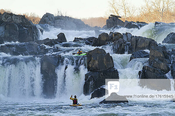 Kayakers running Great Falls of the Potomac River.; Great Falls  Maryland.