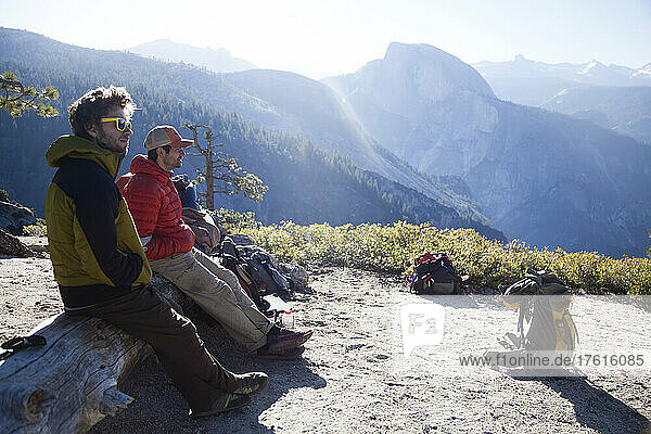 A couple of climbers in front of half dome in Yosemite.
