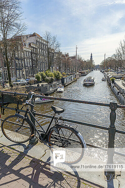Bicycle parked on canal bridge  Lekkeresluis in Amsterdam; Amsterdam  North Holland  Netherlands