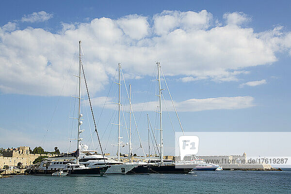 Yachts moored in Kolona Harbour in the medieval city of Rhodes  Greece; Rhodes  Dodecanese  Greece