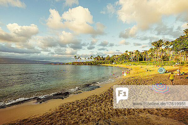 Tourists enjoying Kapalua Beach at sunset; Kapalua  Maui  Hawaii  United States of America