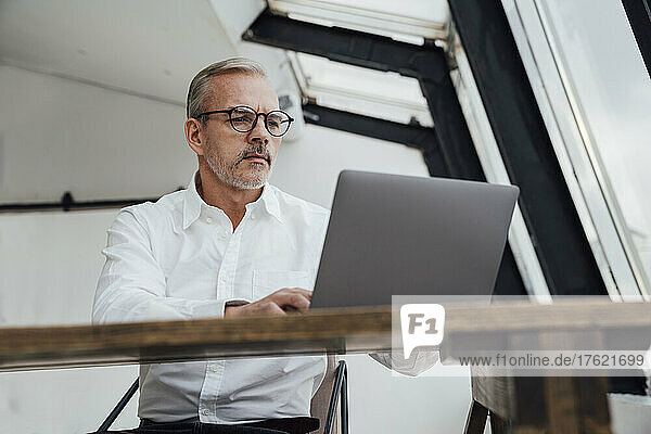 Businessman working on laptop at startup office