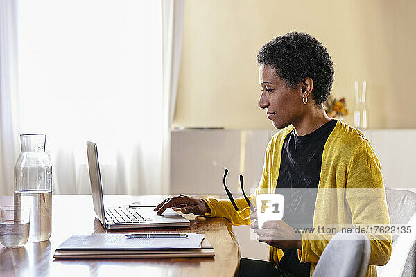 Businesswoman working on laptop in home office