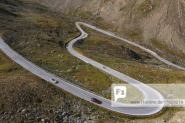 Cars driving along winding Timmelsjoch pass