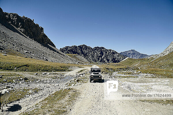 Off-road vehicle at Colle Sommeiller on sunny day  Turin  Italy