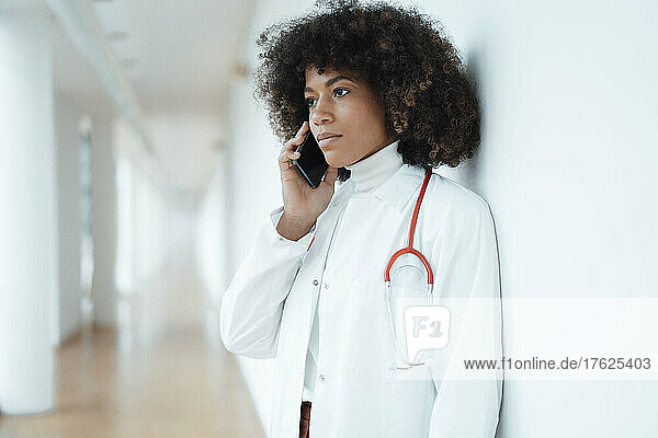 Healthcare worker talking on smart phone in hospital