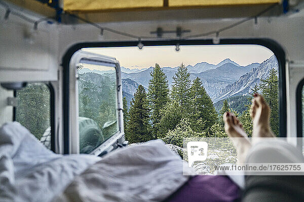 Beautiful view of mountain range and trees seen through camper van  Col d'Izoard  Arvieux  France