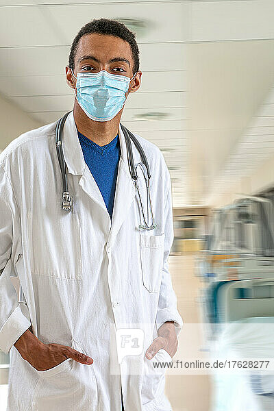 Portrait of a doctor in hospital and sanitary rules  wearing a mask.